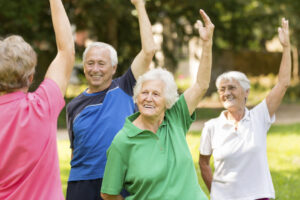 Group of people in their 70s exercising