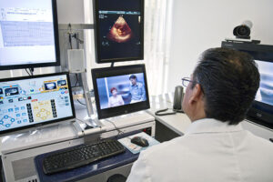 Doctor looking at medicine through a telemedicine view.