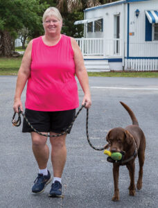 Pam Wood walking her dog